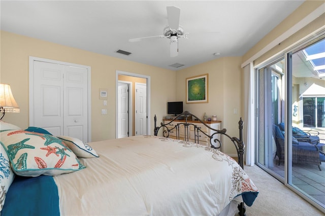 carpeted bedroom with ceiling fan, access to outside, and a closet