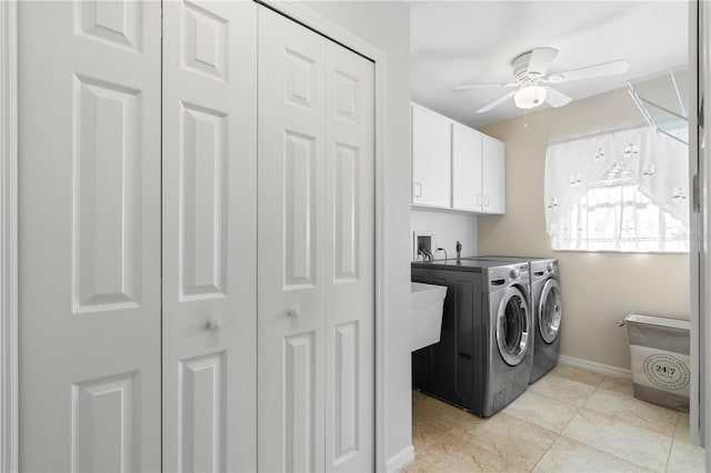 laundry room featuring ceiling fan, cabinets, light tile patterned floors, and washing machine and dryer