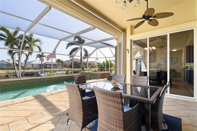 view of patio featuring ceiling fan and a lanai