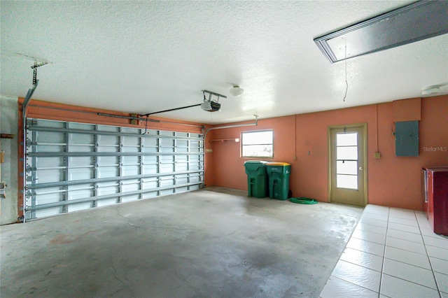 garage featuring a garage door opener and electric panel