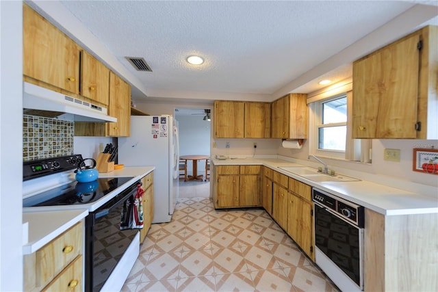 kitchen featuring a textured ceiling, oven, white range with electric cooktop, and sink