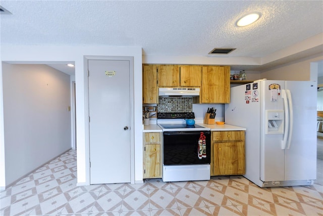 kitchen featuring range with electric stovetop, white fridge with ice dispenser, and a textured ceiling