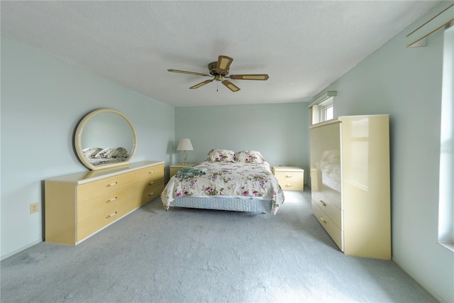 bedroom with ceiling fan and light colored carpet