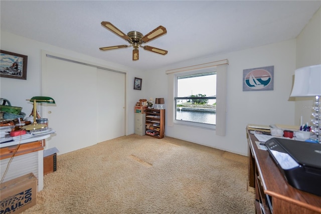 office featuring carpet and ceiling fan