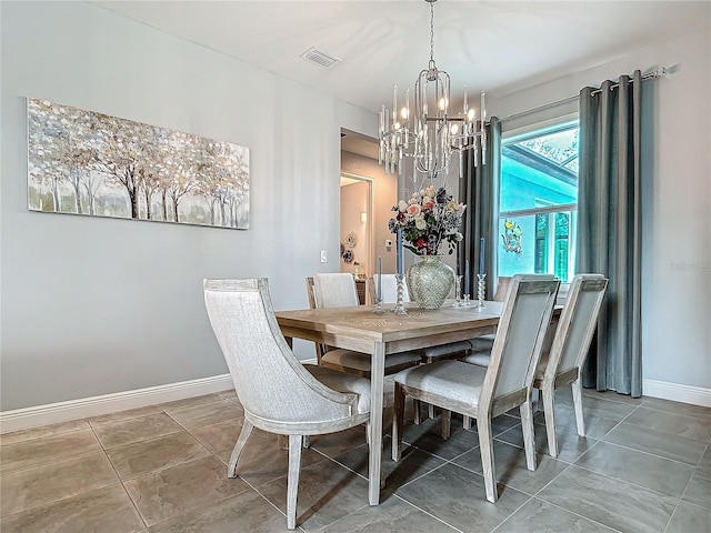 dining area with an inviting chandelier