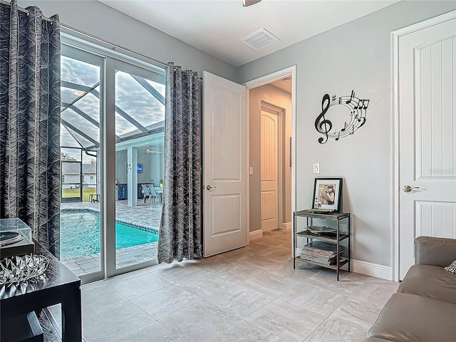 doorway to outside featuring light tile patterned floors