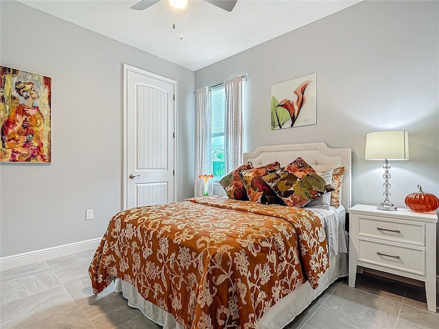 tiled bedroom with ceiling fan