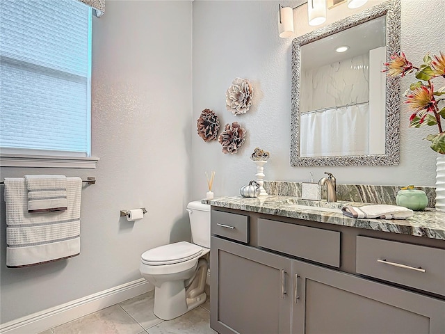 bathroom featuring tile patterned floors, walk in shower, vanity, and toilet