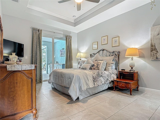 tiled bedroom with ceiling fan, a raised ceiling, crown molding, and access to outside