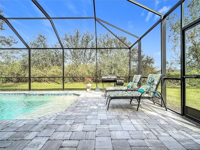 exterior space featuring a patio and glass enclosure