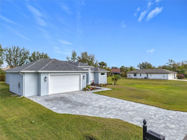 ranch-style house with a front yard and a garage