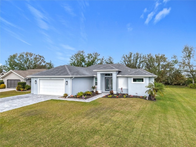 single story home featuring a garage and a front lawn