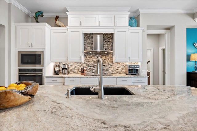 kitchen with built in microwave, stainless steel oven, wall chimney range hood, tasteful backsplash, and light stone counters