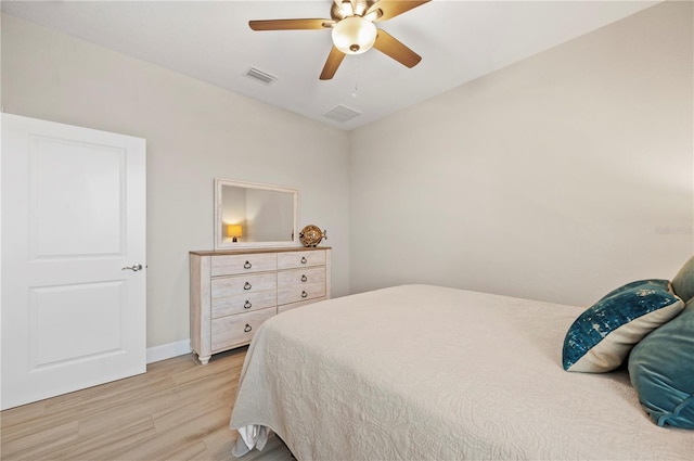 bedroom featuring light hardwood / wood-style floors and ceiling fan