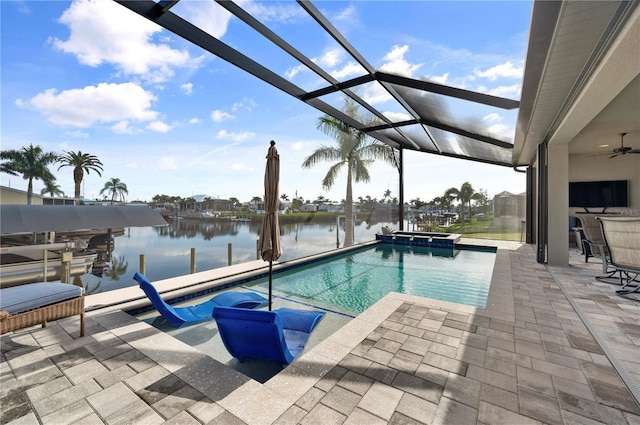 view of pool featuring glass enclosure, a dock, and a patio