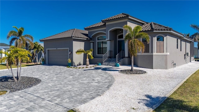 mediterranean / spanish house featuring a garage