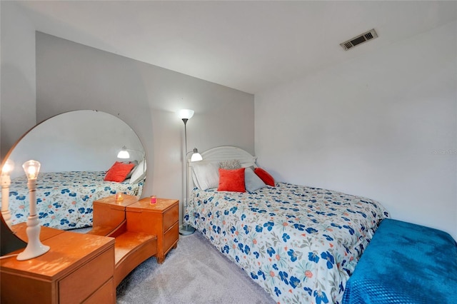 bedroom with light colored carpet