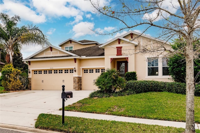 craftsman inspired home featuring a garage and a front yard