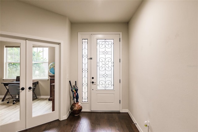 entryway with french doors and dark hardwood / wood-style flooring