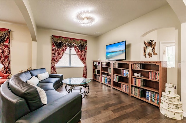 sitting room featuring dark hardwood / wood-style flooring and a textured ceiling