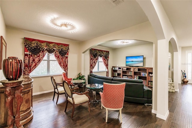 dining space with dark hardwood / wood-style flooring