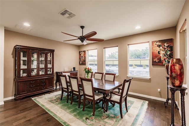 dining space with dark hardwood / wood-style floors and ceiling fan