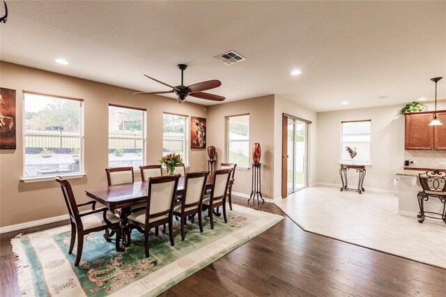 dining area featuring ceiling fan and light hardwood / wood-style flooring