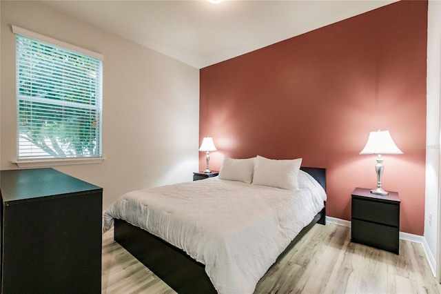 bedroom with light wood-type flooring