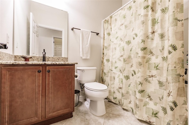 bathroom with tile patterned flooring, vanity, a shower with shower curtain, and toilet