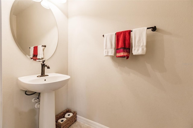 bathroom with tile patterned floors