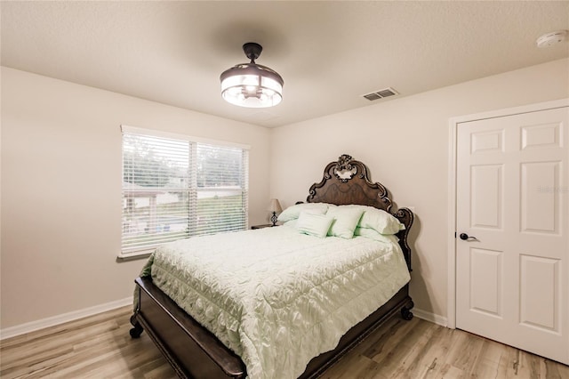 bedroom with light wood-type flooring