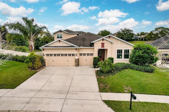 view of front of property with a front yard and a garage