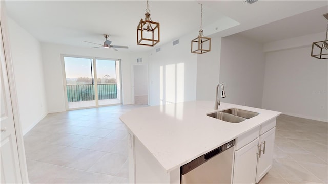 kitchen featuring pendant lighting, dishwasher, a center island with sink, and sink