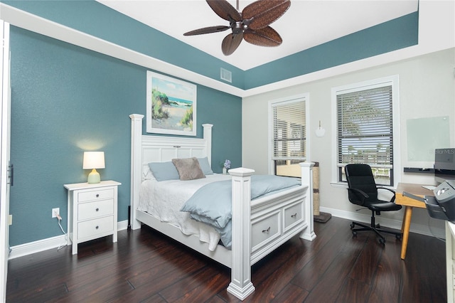 bedroom featuring ceiling fan and dark hardwood / wood-style floors