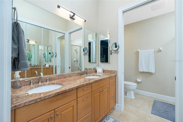 bathroom featuring vanity, toilet, a shower with door, and tile patterned flooring