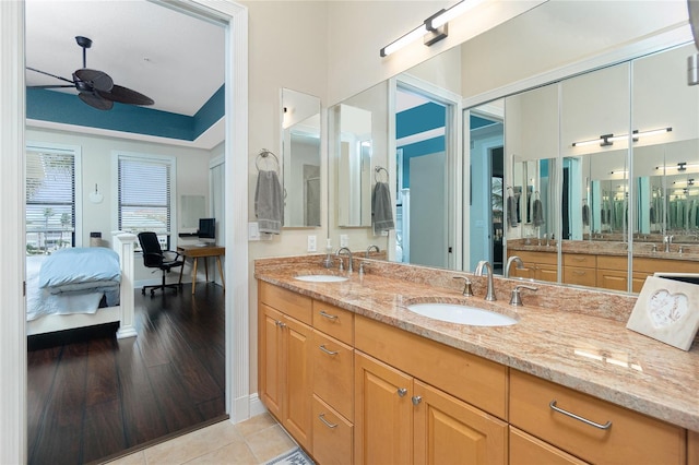 bathroom featuring ceiling fan, tile patterned floors, and vanity