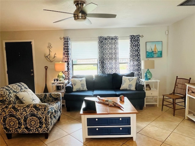 tiled living room with ceiling fan