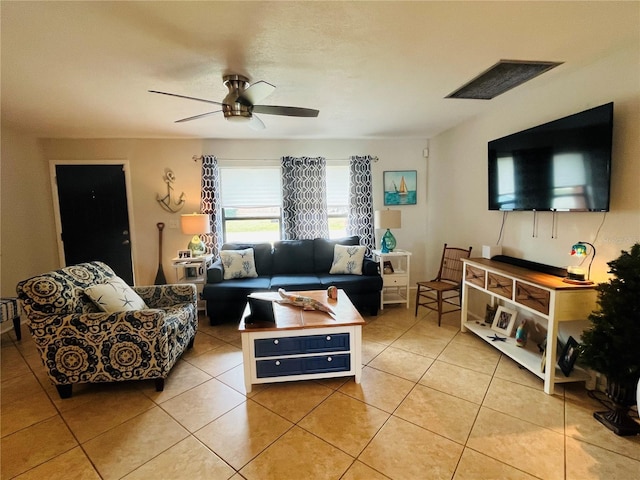 tiled living room featuring ceiling fan