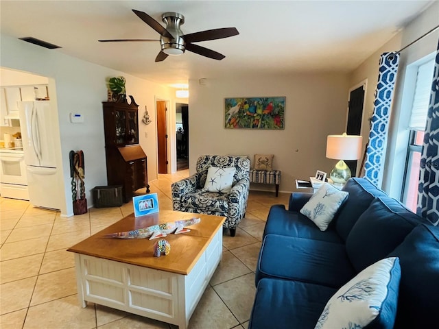 living room with ceiling fan and light tile patterned floors