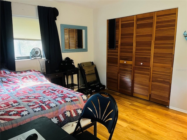 bedroom with a closet and light wood-type flooring