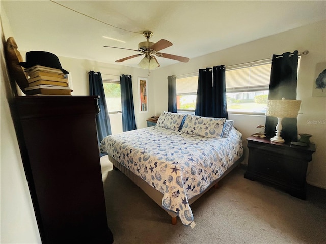 bedroom with ceiling fan and carpet floors