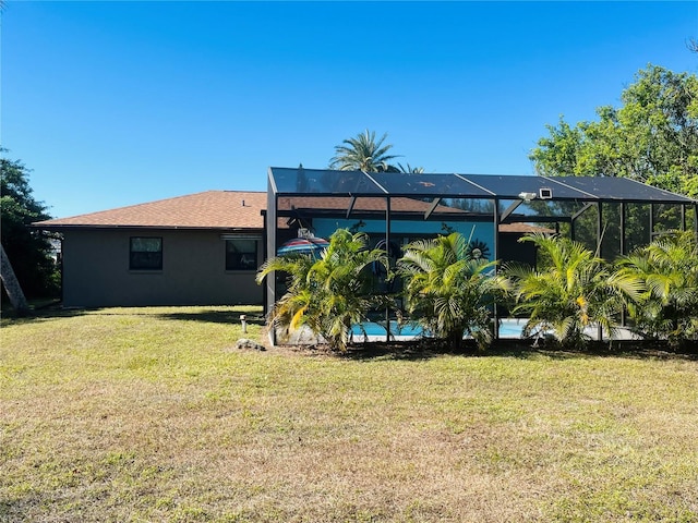 view of yard featuring glass enclosure