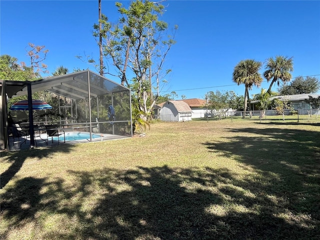 view of yard with glass enclosure