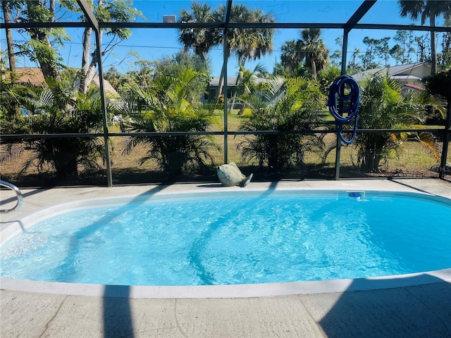 view of pool featuring a lanai