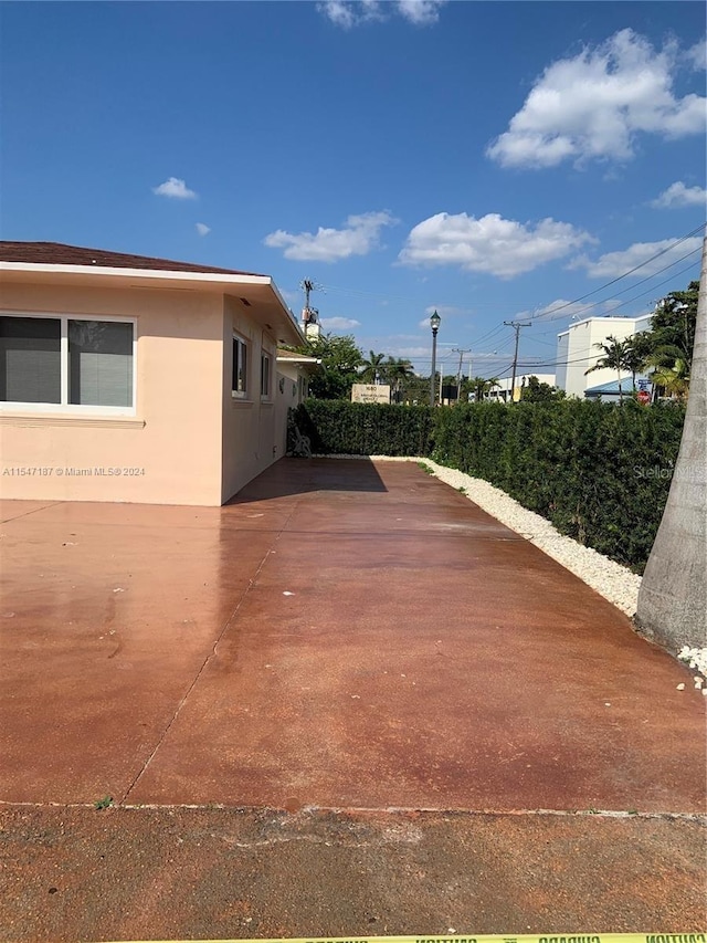 view of property exterior featuring a patio