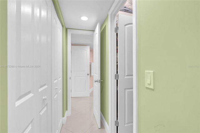 corridor featuring light tile patterned floors