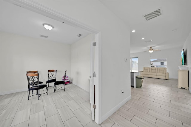 interior space featuring ceiling fan