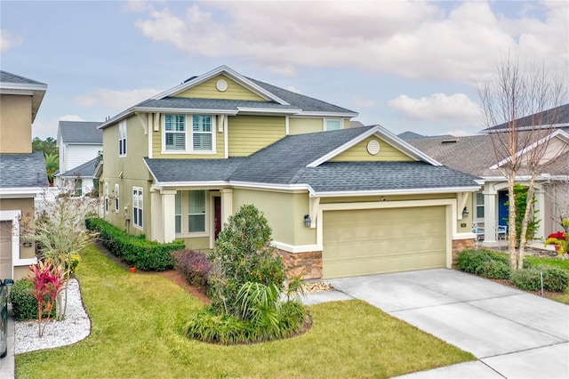 craftsman-style home with a front lawn and a garage