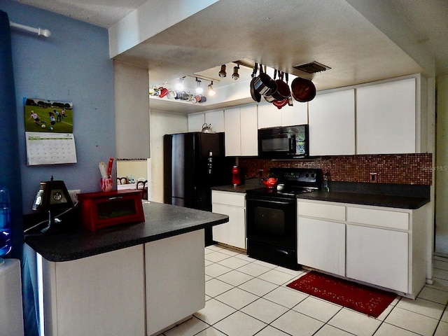 kitchen with light tile patterned floors, backsplash, white cabinetry, and black appliances