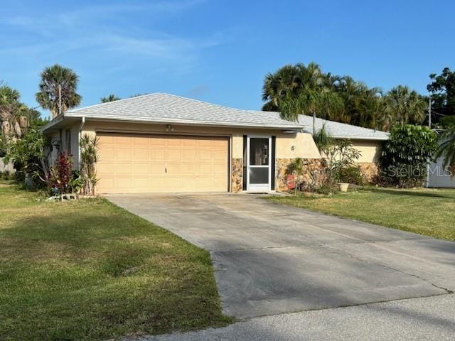 ranch-style home with a front yard, stone siding, a garage, stucco siding, and driveway